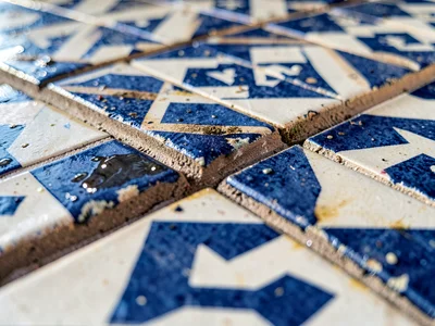 Fountain edge tiles showing water wear pattern