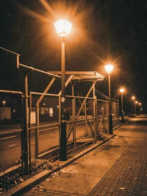 Fire escape in orange light, urban safety infrastructure, midnight metal
