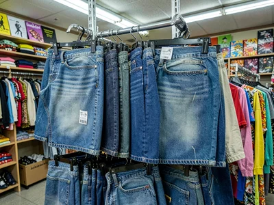 Denim section, blues of every wash, previous lives in faded patterns