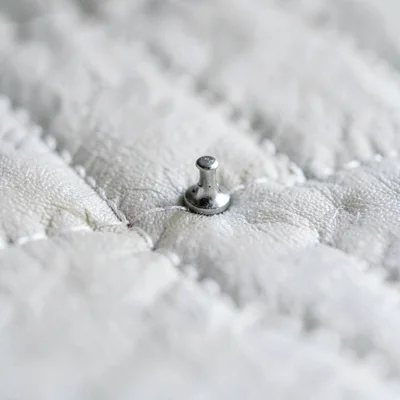Macro of feed dog impression on freshly machine-quilted line
