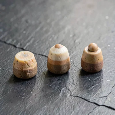 Mineralcut study of three textured set-piece samples in graduated sizes on slate