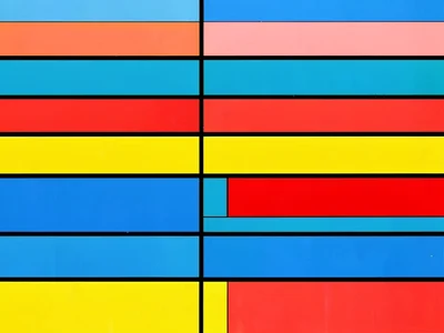 Fields and sky from above — pure horizontal color bands in primary palette
