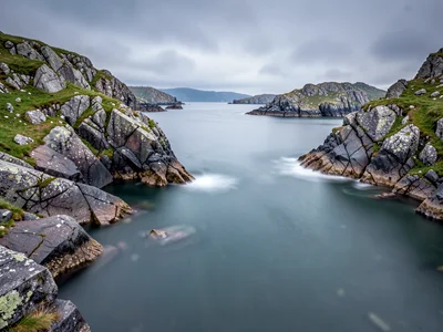 Rocky archipelago with smooth water filling between