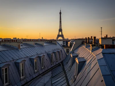 Parisian rooftop view with zinc mansard roofs stretching to the Eiffel Tower sil