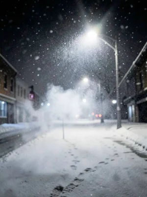 Breath visible in freezing cold air, backlit by streetlight, night, falling snow