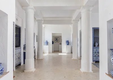 Extreme minimalist restraint of Muscat, Oman, souq interior with white columns, 