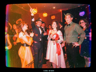 Tape-worn recording of halloween party, costumes, orange lighting, 1990s feel