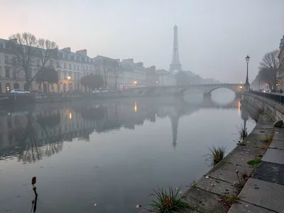 Seine surface perfectly still reflecting soft gray