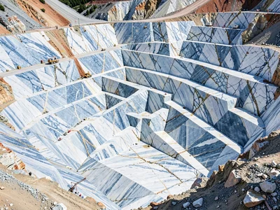 Fresh quarry cut showing blue-white crystalline marble surface