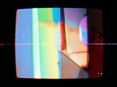 VHS pause showing color bleeding, red channel smearing right from bright objects