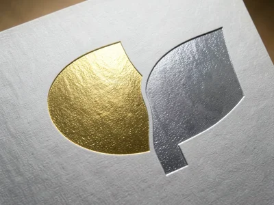 Two-tone foil, gold on one half meeting silver on other, boundary line where met