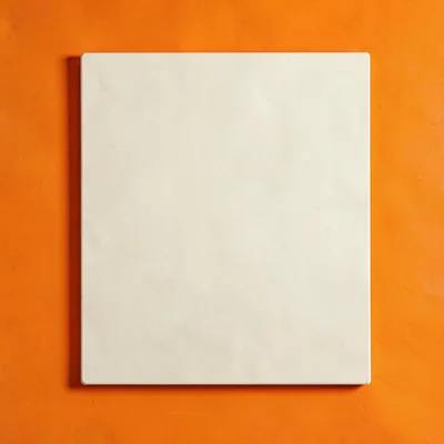 single matte-cream calf-stretcher slant-board top-down on a saturated marigold b