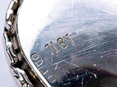 Silver jewelry macro showing marks