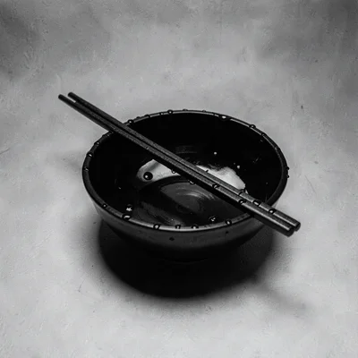 Stark minimalist composition, high contrast black and white tones, Single chopst