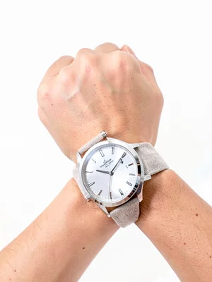 Watch on wrist, white backdrop