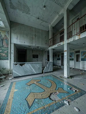 Cracked Hammer-and-Sickle Mosaic in Reception Floor