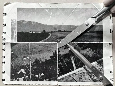 A pair of scissors cutting through a photocopied landscape, the cut revealing a 