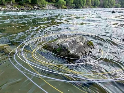 Current lines visible around submerged rock