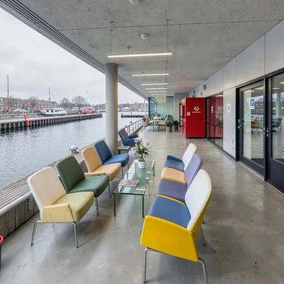 Danish design infrastructure, hygge mechanics, Ferry terminal waiting area, rows