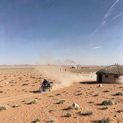 Gobi steppe horizontal, Mongolian vastness, Motorcycle pulling cart across deser