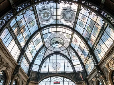 Glass ceiling of train station, Victorian ironwork making mandalas of the sky