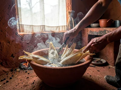 Corn Husks Soaking in Clay Basin
