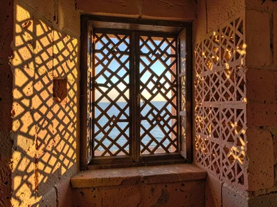 Afternoon sun through mashrabiya lattice in Lamu, Kenya, Window with mashrabiya,