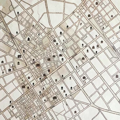 Sepia-ink map of a city neighborhood with tiny landmark icons