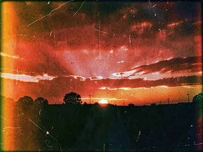 Sunset with enhanced red from decay
