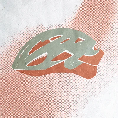 Two-color screenprint motif of a cycling helmet silhouette in sage and rust over