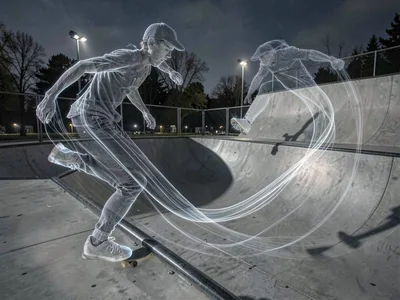 Skate park with skater's path accumulated into flowing ghost lines