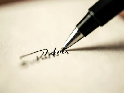 Pen tip on signature line