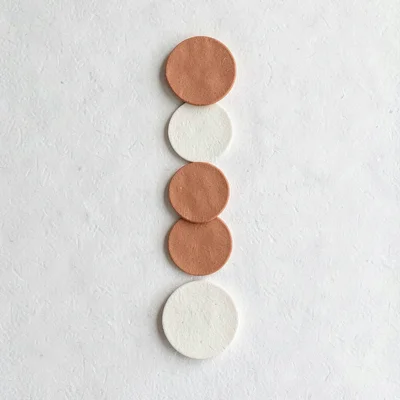 Abstract checklist of soft rounded circles arranged in a loose vertical column,