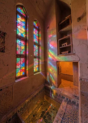 Colored light through qamariya windows in Sana'a, Yemen, tower house stairwell w