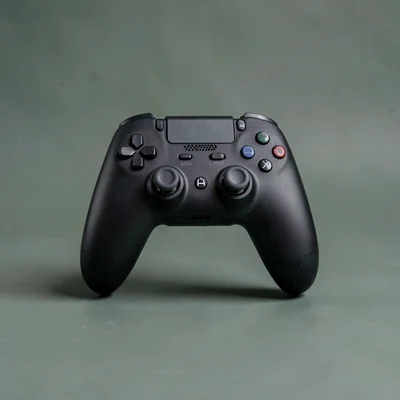 single matte-black gaming-controller dock straight-on against a deep sage backdr