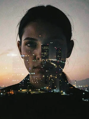 Insomniac's face overlaid with city lights, the 3am buzz that won't stop