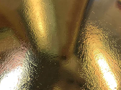 Gold leaf reflecting adjacent colors