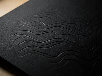 Blind embossed wave pattern on black paper, visible only through light angle cha