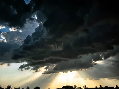 Dark sky over sunlit foreground contrast