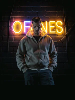 Figure under neon sign