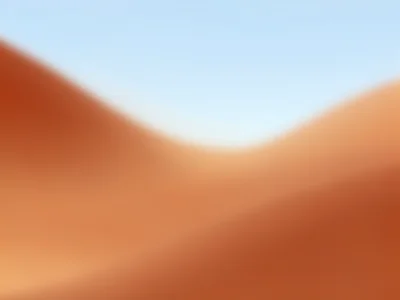 A desert gradient: terracotta flowing through sand to pale sky blue, warm and ar