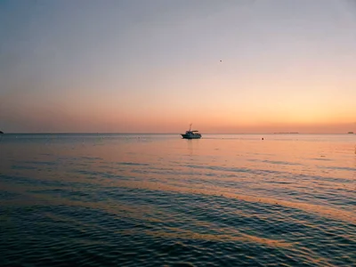 Horizon with dot of boat