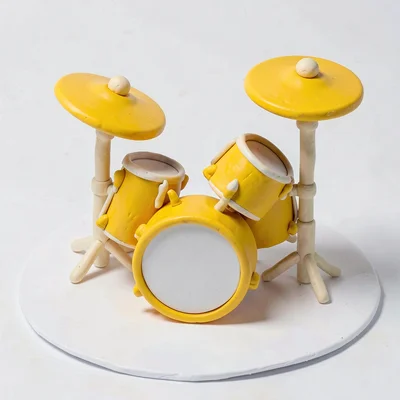 Bold chunky clay drum kit cymbal in primary yellow with stubby cream-toned stand