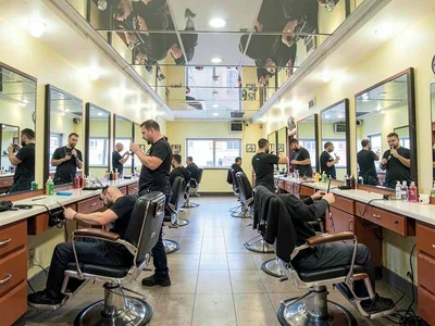 A barbershop's parallel mirrors creating infinite regression, barber repeated fo