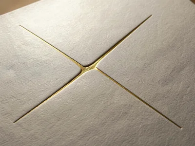Matte gold foil with single deep crease line crossing diagonally, minimal disrup