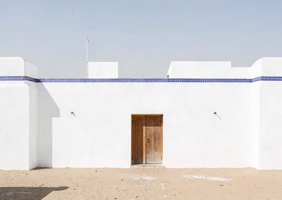 Extreme minimalist restraint of Muscat, Oman, fortress wall with single wooden d