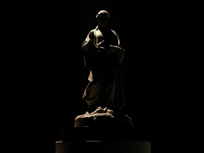 Statue lit from below dramatic