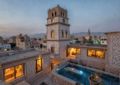 Colored light through qamariya windows in Sana'a, Yemen, rooftop view of tower h