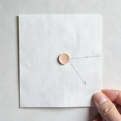 Back-page parting plate of a single index card with a hand-pinned color swatch a