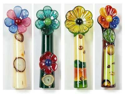 Cane bundle cross-section comparison — four different flower designs side by sid